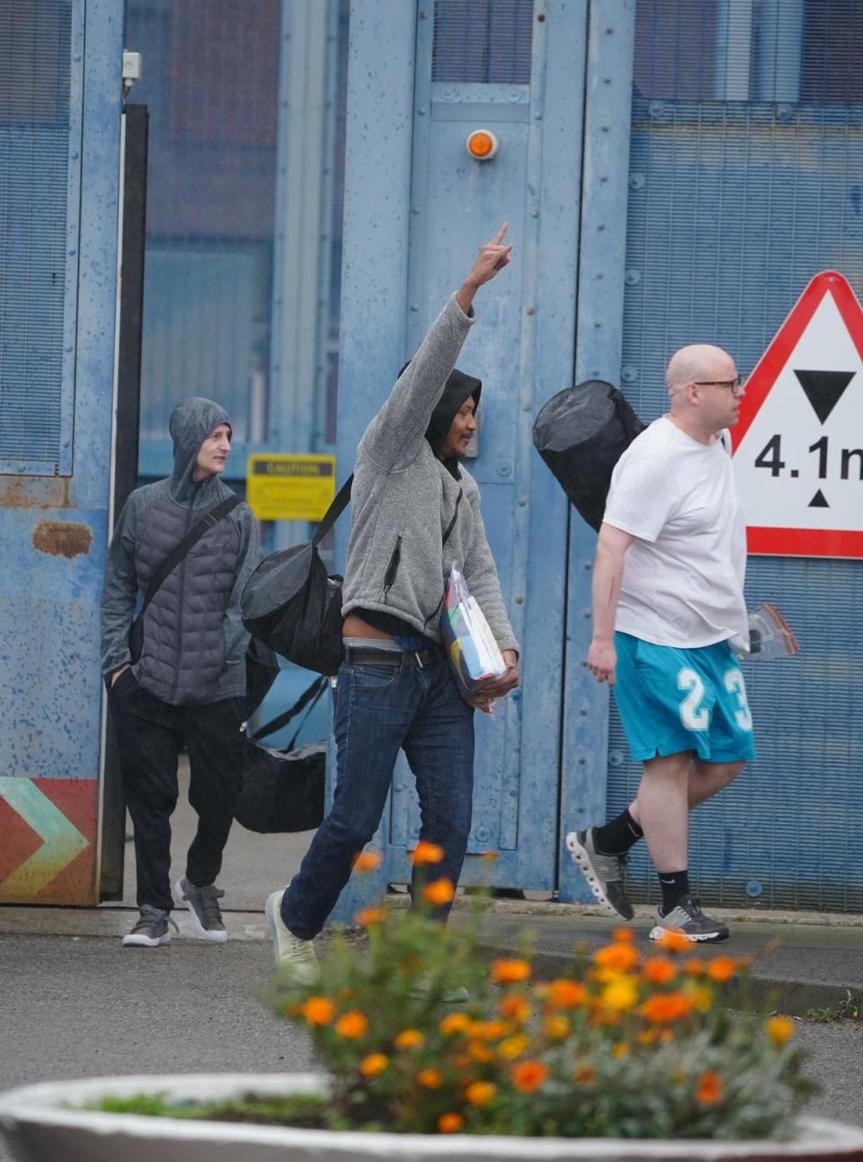 Prisoners celebrated their release from HMP Liverpool after serving 40 per cent of their sentence under emergency measures to ease overcrowding (PA)