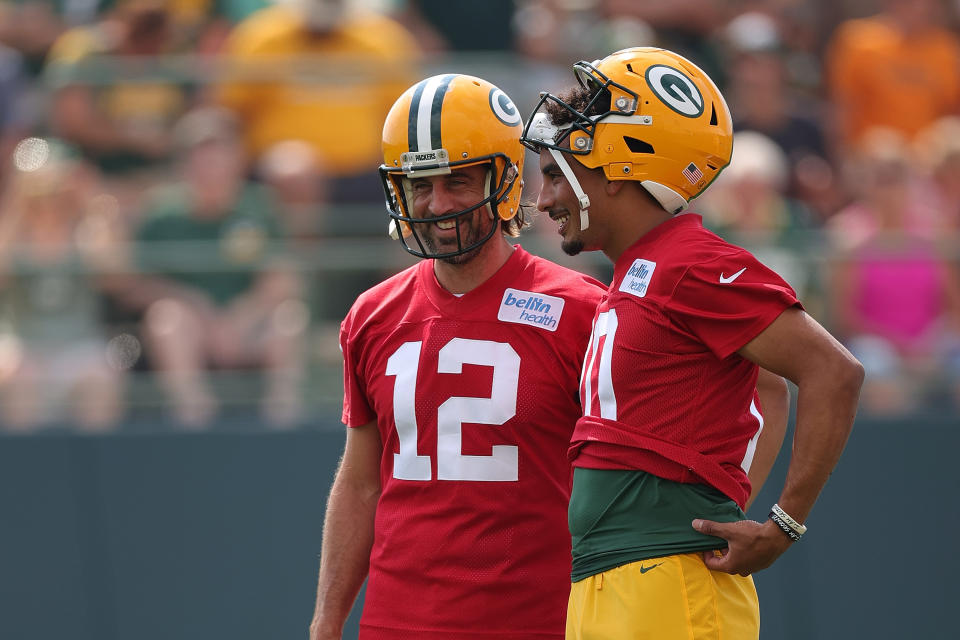 ASHWAUBENON, WISCONSIN - JULY 29: Jordan Love #10 and Aaron Rodgers #12 of the Green Bay Packers work out during training camp at Ray Nitschke Field on July 29, 2021 in Ashwaubenon, Wisconsin. (Photo by Stacy Revere/Getty Images)