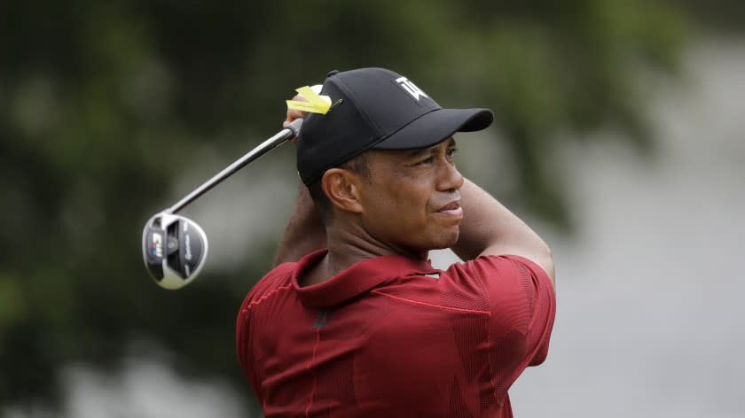 Tiger Woods hits from the ninth tee during the final round of the Memorial.