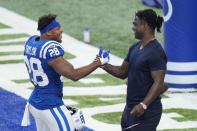 Indianapolis Colts' Jonathan Taylor (28) talks with former Indianapolis Colts running back Edgerrin James before an NFL football game between the Indianapolis Colts and the Los Angeles Rams, Sunday, Sept. 19, 2021, in Indianapolis. (AP Photo/AJ Mast)