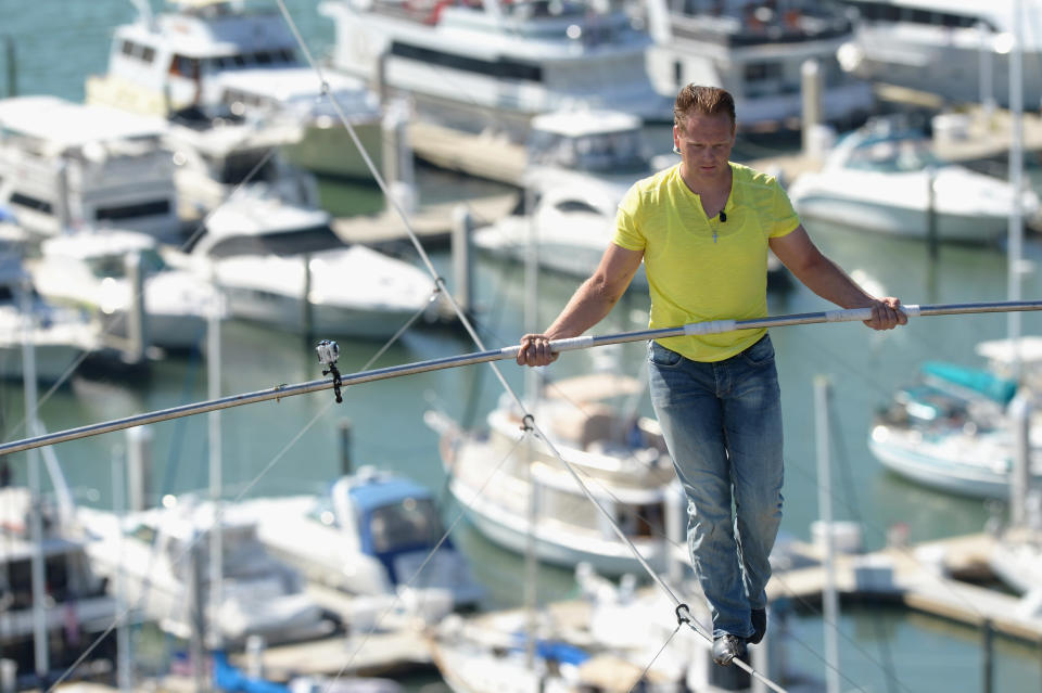 Nik Wallenda walks across a tightrope 200 feet above U.S. 41 on January 29, 2013 in Sarasota, Florida. (Photo by Tim Boyles/Getty Images)