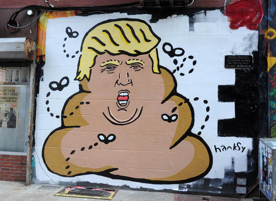 <p>A mural by street artist Hanksy depicting Donald Trump as poop is seen on New York’s Lower East Side. (Dennis Van Tine/AP) </p>