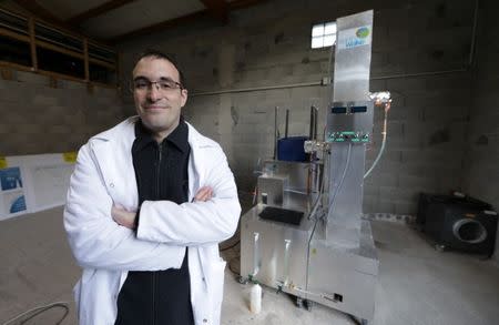 Christofer Costes, a French inventor who created a machine that turns plastic waste into fuel, poses with his invention in Puget-Theniers, France, December 14, 2018. Picture taken December 14, 2018. REUTERS/Eric Gaillard