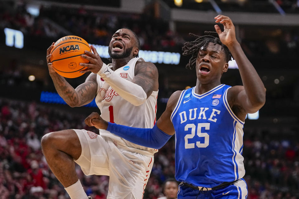 Houston's Jamal Shead (1) goes up for a basket against Duke's Mark Mitchell (25) during the first half of a Sweet 16 college basketball game in the NCAA Tournament in Dallas, Friday, March 29, 2024. Shead went down on the play and headed to the locker room with team trainers. (AP Photo/Tony Gutierrez)