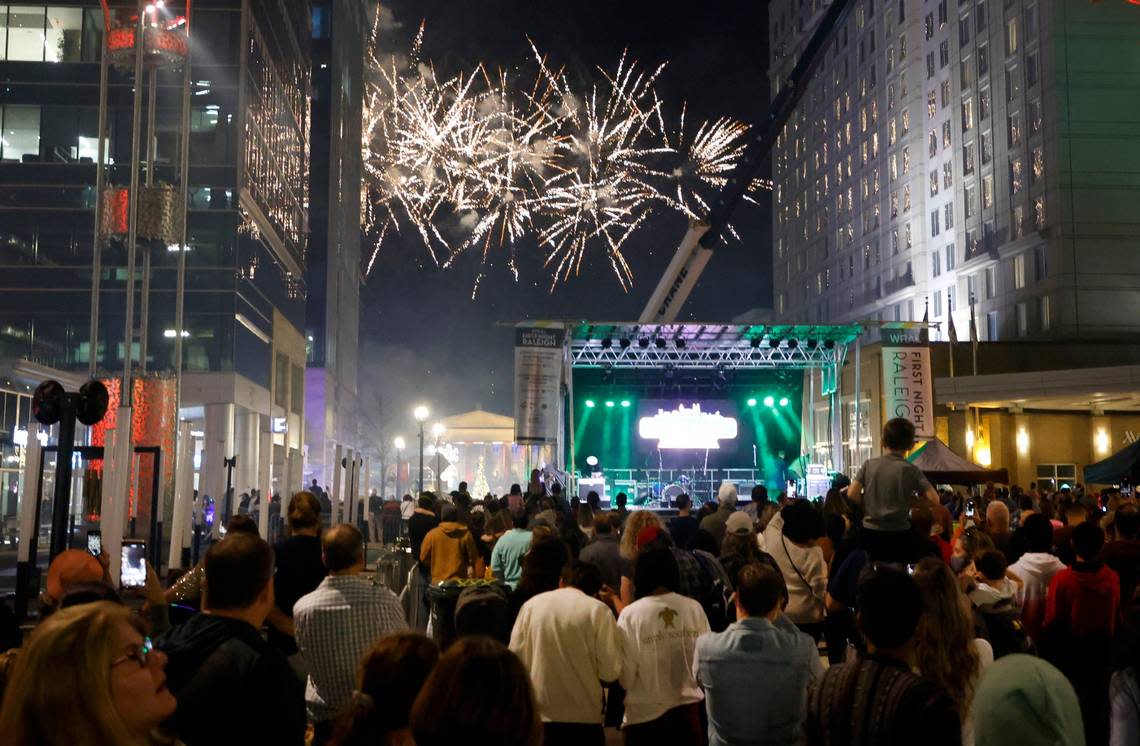 Fireworks light up the night as it hits 7 p.m. during the early countdown during First Night Raleigh in downtown Raleigh, Friday, Dec. 31, 2021.