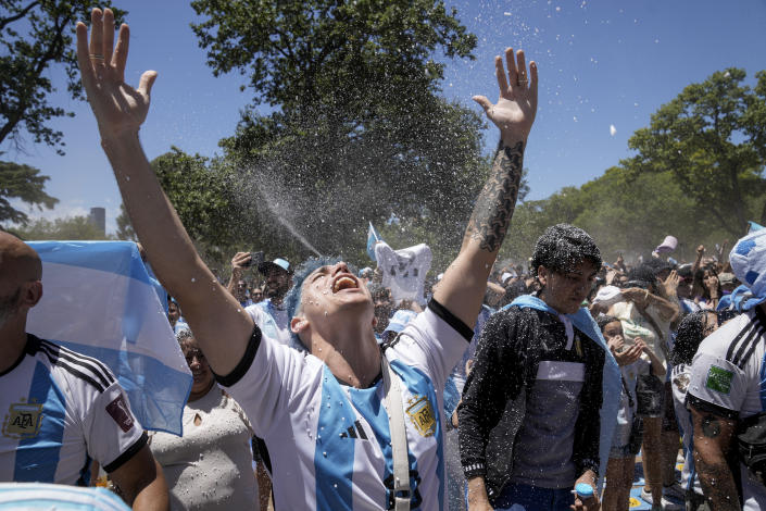 Argentine soccer fans celebrate their team's opening goal during the World Cup final soccer match between Argentina and France in Buenos Aires, Argentina, Sunday, Dec. 18, 2022. (AP Photo/Rodrigo Abd)