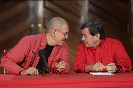 Antonio Garcia (L) and Pablo Beltran, representatives of the delegation of National Liberation Army (ELN) for formal peace talks with Colombian government, attend a news conference in Caracas, March 30, 2016. REUTERS/Marco Bello