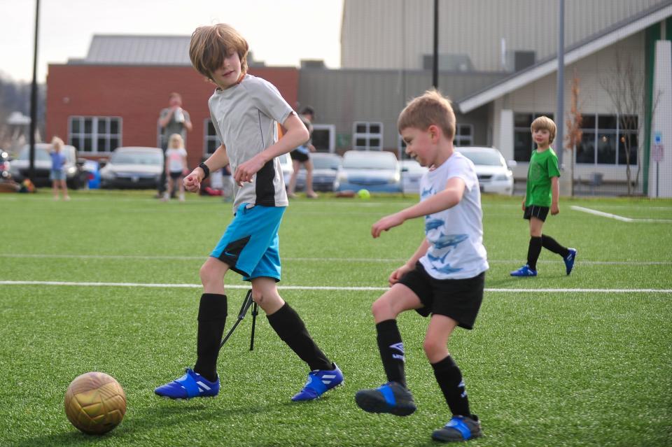 Children kick a soccer ball around at the Emerald Youth Sports Complex in Lonsdale. The organization has seen a surge in enrollment.