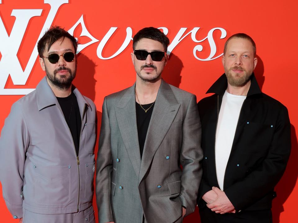 Ben Lovett, Marcus Mumford and Ted Dwane of the Mumford and Sons group attend the Louis Vuitton Menswear Fall/Winter show