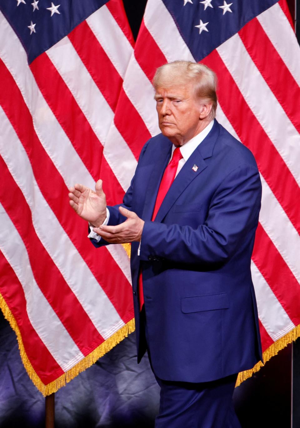 Republican presidential nominee and former U.S. President Donald Trump applauds during a campaign event in Asheville, North Carolina, U.S. August 14, 2024. REUTERS/Jonathan Drake