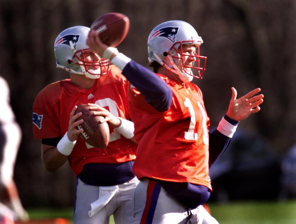 Drew Bledsoe and backup Tom Brady during a practice in 2000 after Brady was selected with the 199th pick in that year's NFL draft. (Photo by Barry Chin/The Boston Globe via Getty Images)