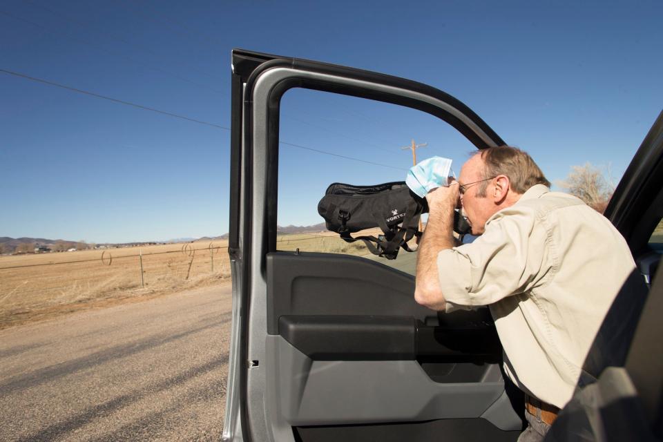 Biologist Keith Day searches for species of raptors during a survey in the Cedar City area on Monday. The area attracts birds of prey from throughout the region during the winter, although Day said he has spotted fewer in recent years.