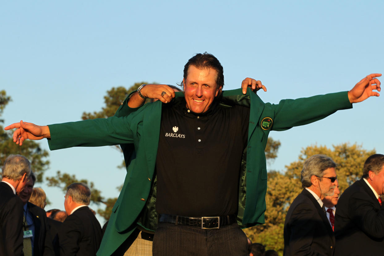 AUGUSTA, GA - APRIL 11:  (L-R) Angel Cabrera of Argentina presents Phil Mickelson with the green jacket during the green jacket presentation after the final round of the 2010 Masters Tournament at Augusta National Golf Club on April 11, 2010 in Augusta, Georgia.  (Photo by Jamie Squire/Getty Images)