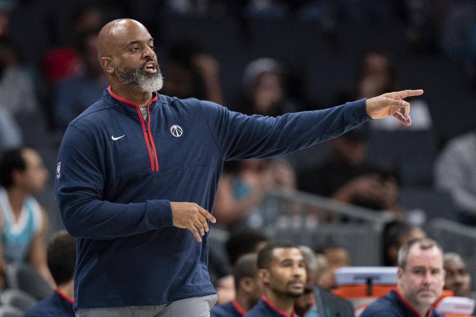 Washington Wizards head coach Wes Unseld Jr. looks on in the first half of an NBA preseason basketball game against the Charlotte Hornets in Charlotte, N.C., Monday, Oct. 10, 2022. (AP Photo/Jacob Kupferman)