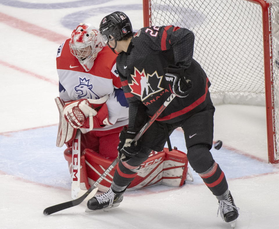 Canada's Dylan Cozens scores the sixth goal of the game for Canada against Czech Republic's goaltender Nick Malik during the second period at the World Junior Hockey Championships on Tuesday, Dec. 31, 2019 in Ostrava, Czech Republic. (Ryan Remiorz/The Canadian Press via AP)
