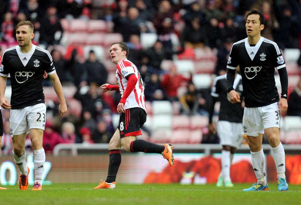 Sunderland's Craig Gardner, center, celebrates his goal during their English FA Cup fifth round soccer match against Southampton at the Stadium of Light, Sunderland, England, Saturday, Feb. 15, 2014. (AP Photo/Scott Heppell)