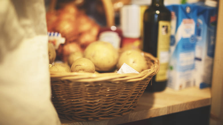 basket of potatoes in cupboard 