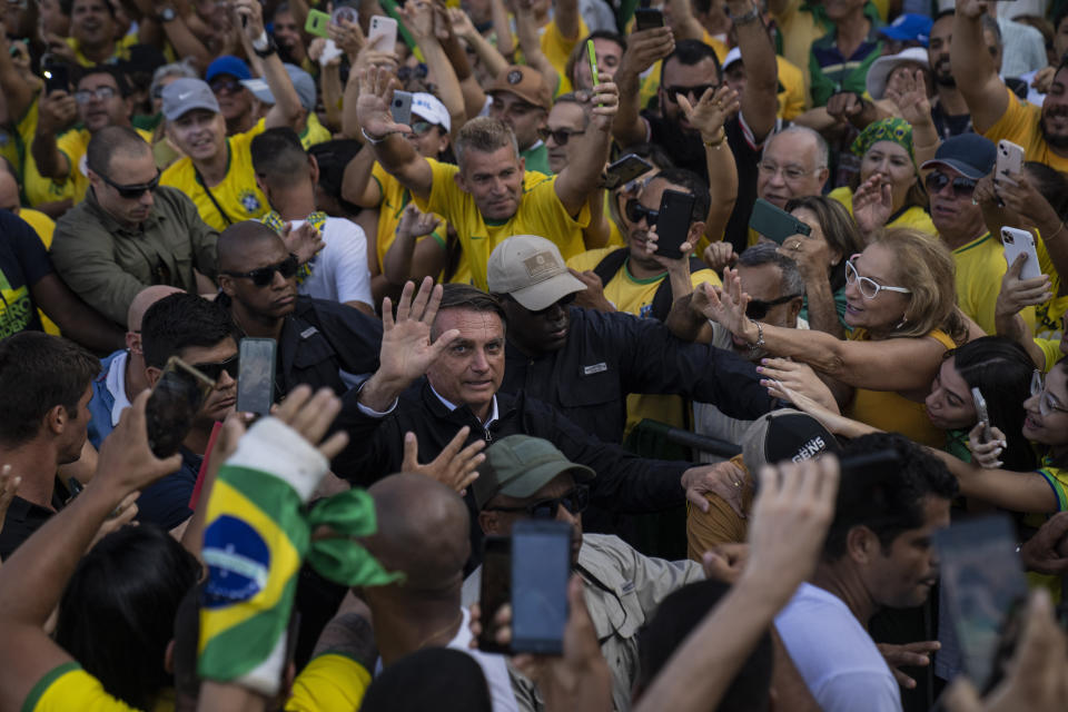 President Jair Bolsonaro greets supporters in Copacabana beach during the country's bicentennial independence celebrations, in Rio de Janeiro, Brazil, Wednesday, Sept. 7, 2022. (AP Photo/Rodrigo Abd)