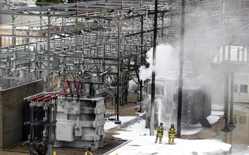 Members of the Madison Fire department respond at the scene of a fire at Madison Gas and Electric, Friday, July 19, 2019 in Madison, Wis. (Steve Apps/Wisconsin State Journal via AP)