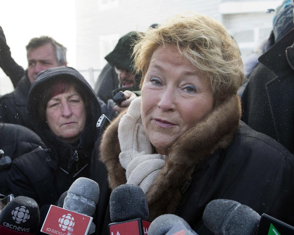 Quebec Premier Pauline Marois visits the site of the fatal fire at a seniors residence, Sunday, Jan. 26, 2014, in L'Isle-Verte, Quebec. (AP Photo/The Canadian Press, Ryan Remiorz)