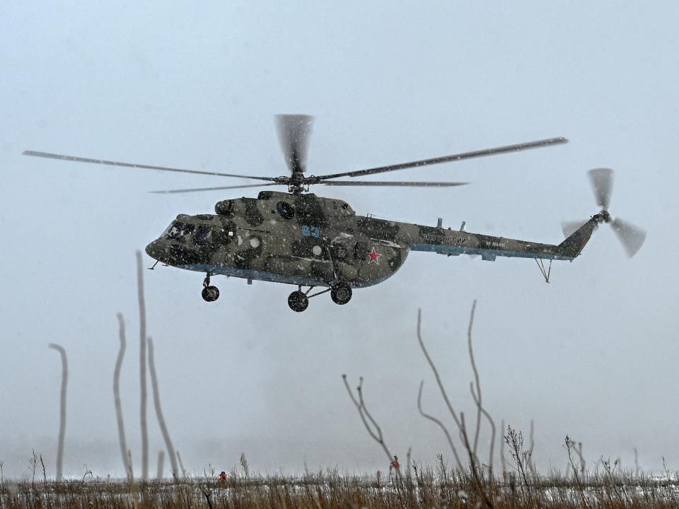 A Russian Mi-8 military helicopter is seen during flight testing conducted by the Russian Air Force of the Southern Military District during snowfall at a military aerodrome in the Rostov region, Russia January 19, 2022. REUTERS/Sergey Pivovarov