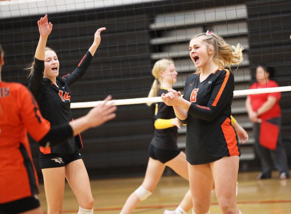 Mediapolis’ Haley Steffener (left)  and Brenna Thie celebrate a point scored by the Bullettes in the home Quad Thursday night.