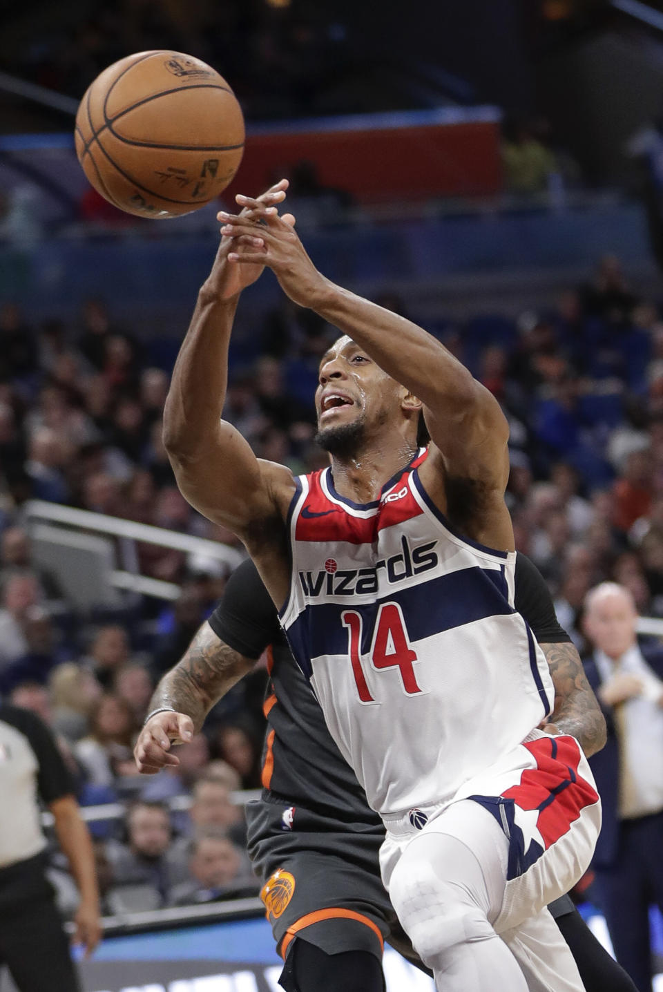 Washington Wizards guard Ish Smith (14) loses control of the ball as he drives around Orlando Magic guard D.J. Augustin, back left, during the first half of an NBA basketball game Wednesday, Jan. 8, 2020, in Orlando, Fla. (AP Photo/John Raoux)