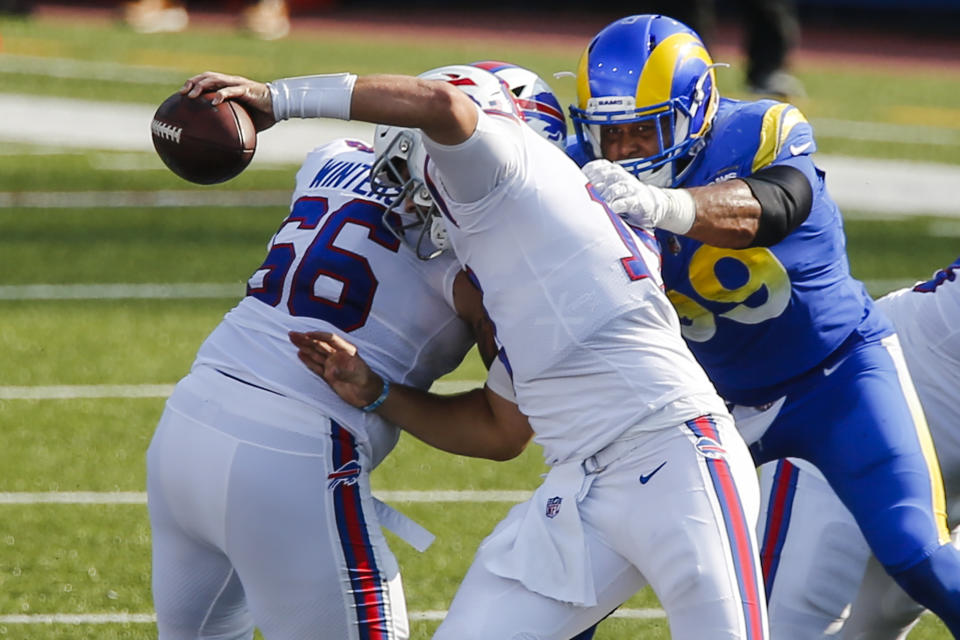 Los Angeles Rams' Aaron Donald (99) sacks Buffalo Bills' Josh Allen (17) during the second half of an NFL football game Sunday, Aug. 26, 2018, in Orchard Park, N.Y. (AP Photo/John Munson)