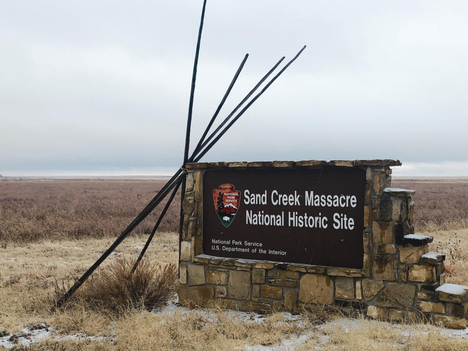 FILE - An entrance sign is shown at the Sand Creek Massacre National Historic Site in Eads, Colo., on Dec. 27, 2019. This quiet piece of land tucked away in rural southeastern Colorado seeks to honor the 230 peaceful Cheyenne and Arapaho tribe members who were slaughtered by the U.S. Army in 1864. It was one of worst mass murders in U.S. history. (AP Photo/Russell Contreras, File)