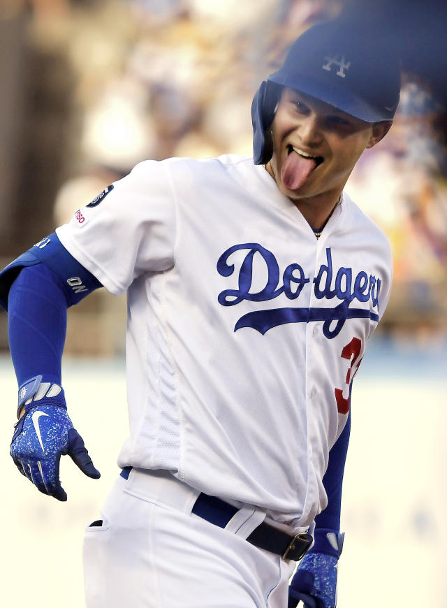 Dodgers slug 7 homers in 16-9 victory over Rockies –