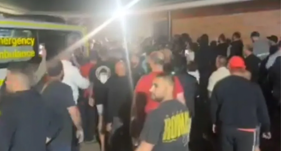 Angry crowds gathered in southwestern Sydney following the stabbing attack, seen here. 
