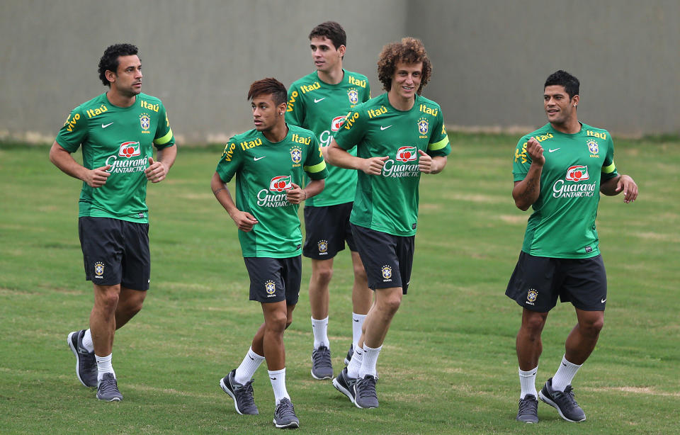 FILE - In this June 28, 2013 file photo, Brazil's players, from left to right: Fred, Neymar, Oscar, David Luiz, and Hulk attend a training session in Rio de Janeiro, Brazil. Brazilian fans hoping for a home-team win at this year's World Cup are hoping just as hard that archrival Argentina does not lift the trophy. (AP Photo/Andre Penner, File)