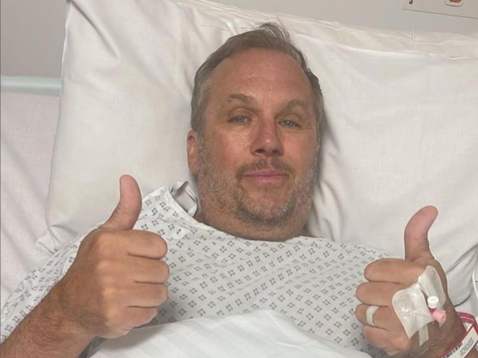 Andrews shared an image from his hospital bed and shared he was ‘happy to have woken up’ (Dean Andrews/ Instagram: @deanoandrews)