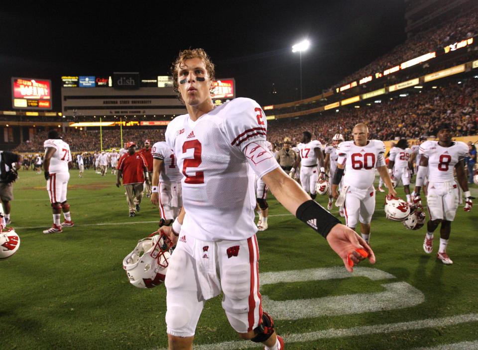 Wisconsin quarterback Joel Stave walks off the field in frustration after a controversial ending in a Badgers loss to Arizona State.
