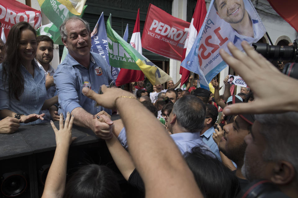 Ciro Gomes, presidential candidate with the Democratic Labor Party, greets supporters as he campaigns in downtown Rio de Janeiro, Brazil, Wednesday, Sept. 12, 2018. Brazil will hold general elections on Oct. 7. (AP Photo/Leo Correa)