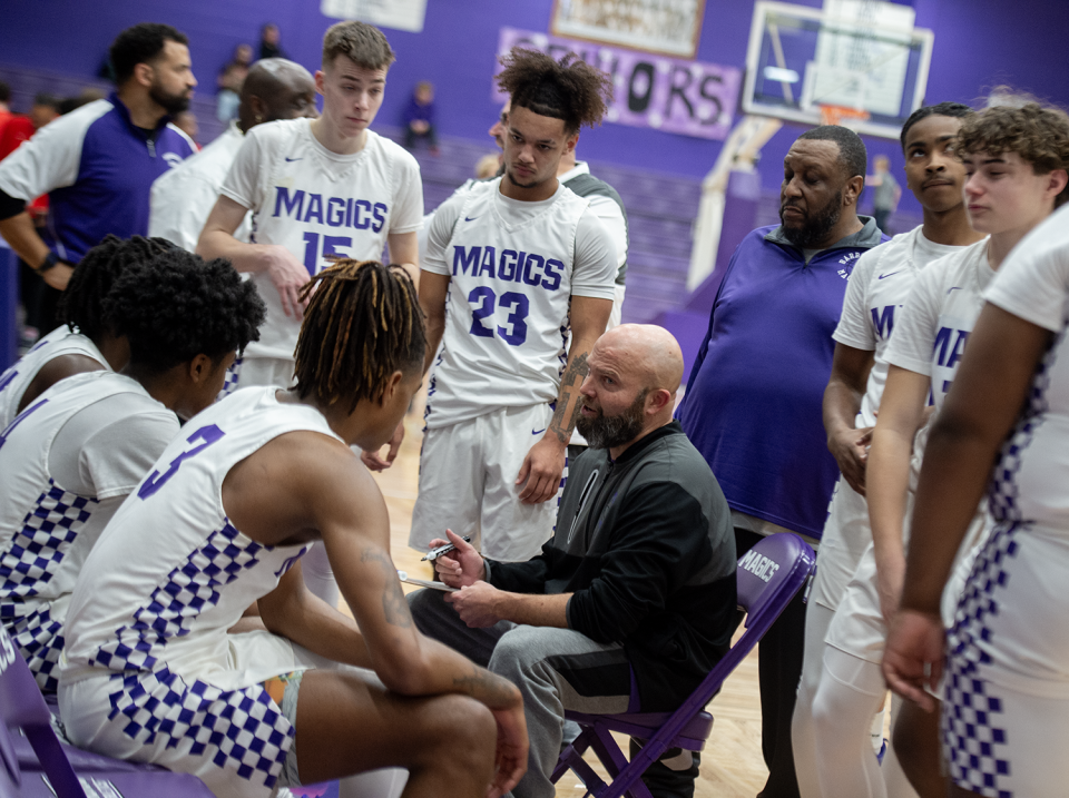 Barberton boys basketball head coach Chad Hazard with his team during a stop in play against Kent Roosevelt on Feb. 9, 2024.