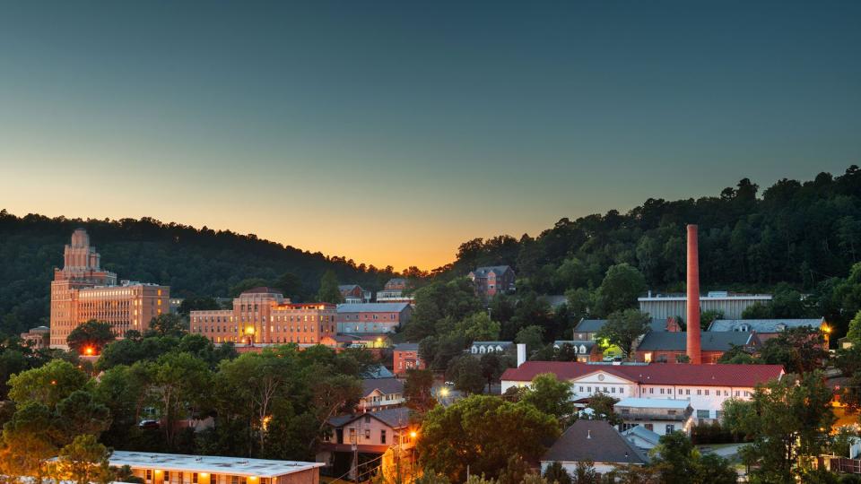 Hot Springs, Arkansas, USA town skyline from above at dawn.