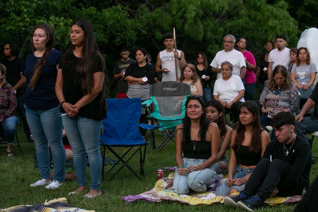 Family and friends mourn the loss of 39-year-old Christina Michelle Limon and her son, 14-year-old Rudy Xavier Limon-Lirra during the memorial service in the east Austin Garden View Drive neighborhood on Friday, April 29, 2022. 