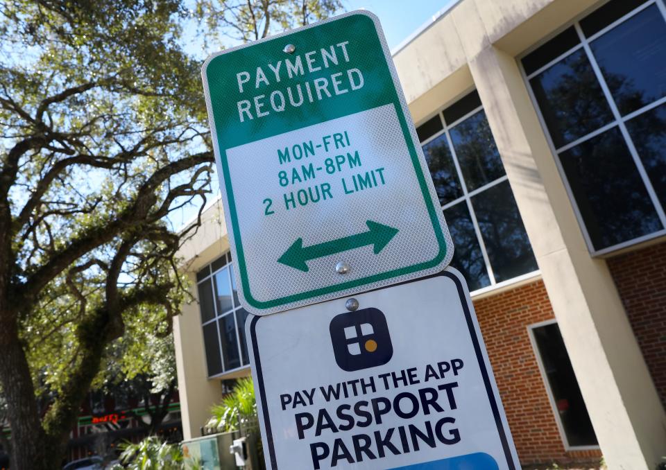 A sign from the city of Gainesville telling motorists they have to pay for two hours of parking at many of the spaces that had been free. The Gainesville City Commission suspended implementation of the plan after an outcry from downtown business owners.