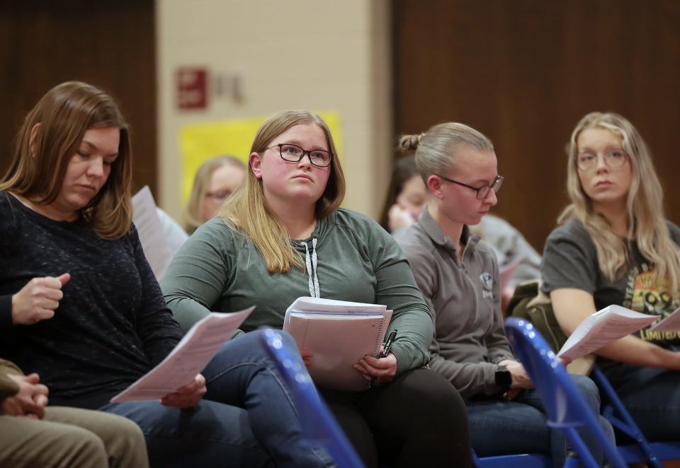 Members of the public listen during an open forum to discuss closing Jefferson Elementary School in the Menasha Joint School District on Feb. 6.