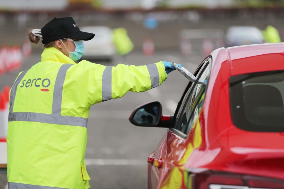 A coronavirus testing official (PA)