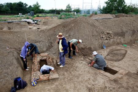 Archaeologists work at the Viminacium site, around 100km east from Belgrade, Serbia August 8, 2016. Picture taken August 8, 2016. REUTERS/Djordje Kojadinovic