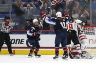 United States' Amanda Kessel (28) celebrates her goal with teammate Kelly Pannek (12) during the second period of a rivalry series women's hockey game against Canada in Hartford, Conn., Saturday, Dec. 14, 2019. (AP Photo/Michael Dwyer)