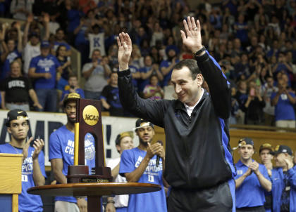 Mike Krzyzewski reacts as the Duke basketball team is welcomed at Cameron Indoor Stadium after their title win. (AP)