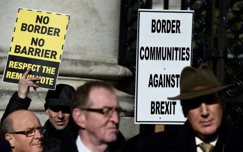 Anti-Brexit campaigners, Borders Against Brexit protest outside Irish Government buildings in Dublin - REUTERS