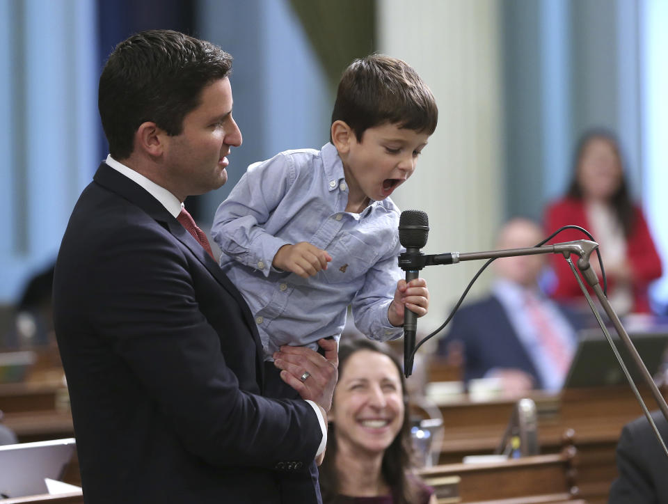 Ethan Gabriel the son of Assemblyman Jesse Gabriel, D-Encino, got into the action of the day as he took over his father's microphone during the Assembly session, Friday, Aug. 31, 2018, in Sacramento, Calif. Ethan was celebrating his fourth birthday Friday and his father brought him to the Assembly for the last day of the legislative session.(AP Photo/Rich Pedroncelli)