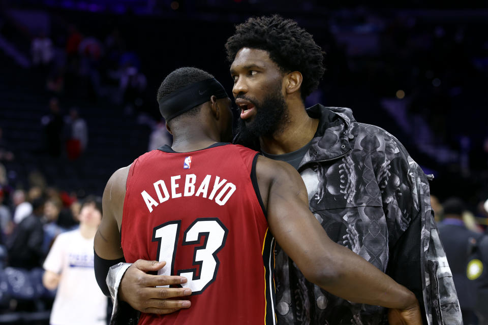 PHILADELPHIA, PENNSYLVANIA - MARCH 18: Bam Adebayo #13 of the Miami Heat and Joel Embiid #21 of the Philadelphia 76ers speak after a game at the Wells Fargo Center on March 18, 2024 in Philadelphia, Pennsylvania. NOTE TO USER: User expressly acknowledges and agrees that, by downloading and or using this photograph, User is consenting to the terms and conditions of the Getty Images License Agreement.  (Photo by Tim Nwachukwu/Getty Images)