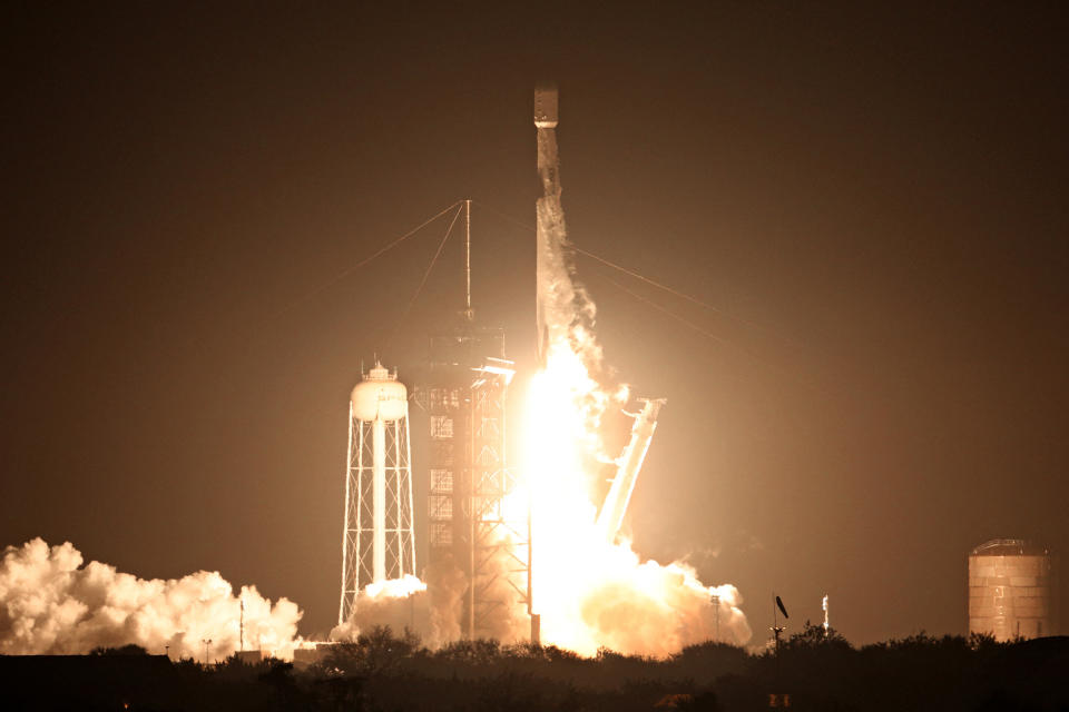 A SpaceX Falcon 9 rocket carrying the Intuitive Machines lunar lander lifts off from Kennedy Space Center in Cape Canaveral.