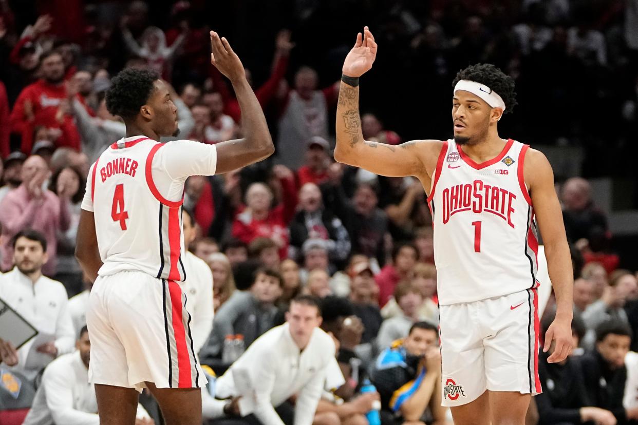 Mar 26, 2024; Columbus, OH, USA; Ohio State Buckeyes guard Dale Bonner (4) gets a high five from guard Roddy Gayle Jr. (1) during the second half of the NIT quarterfinals against the Georgia Bulldogs at Value City Arena. Ohio State lost 79-77.