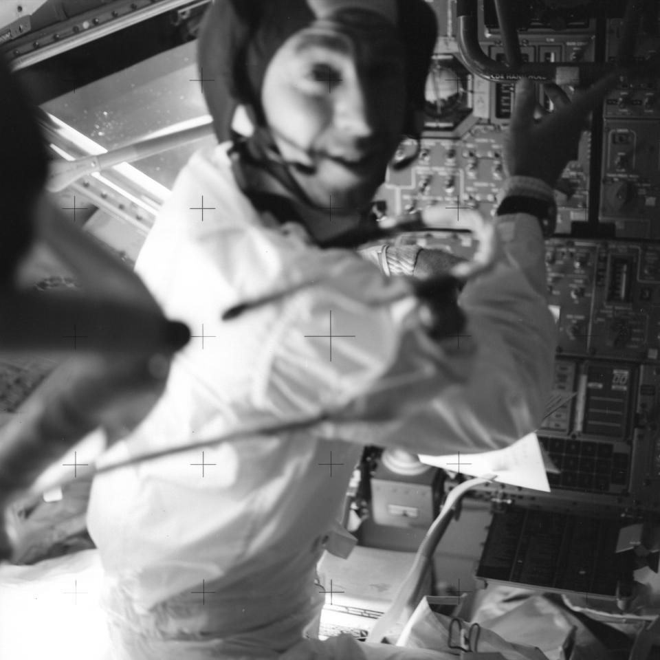 In this April 17, 1970 photo made available by NASA, astronaut Jim Lovell, inside the Apollo 13 lunar module, prepares it for jettison before returning to the command module for splashdown in the Pacific Ocean. (NASA via AP)